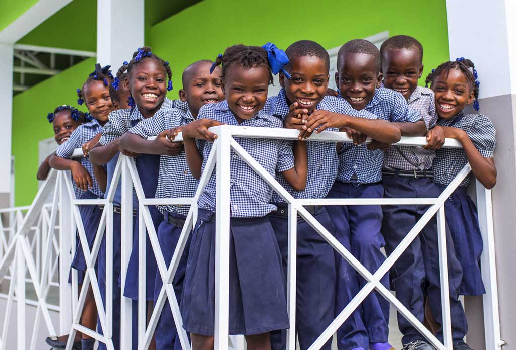 Young students celebrating the opening of the PJ Mara de Jolivert National School in Haiti