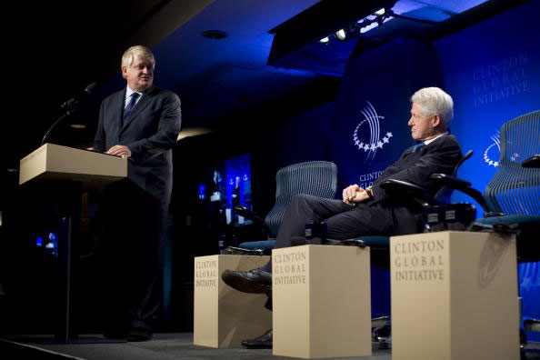 Denis O'Brien, founder and chairman of Digicel, onstage with former president Bill Clinton at an event for the Clinton Global Initiative