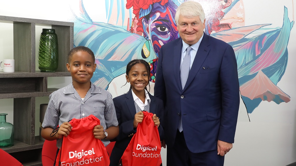 Denis O’Brien stands with two Loop Little Writers