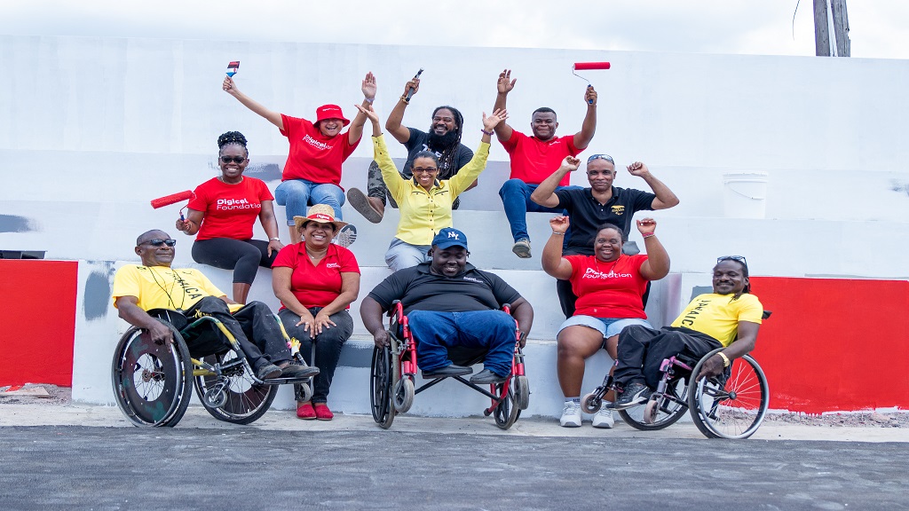 Digicel Foundation and Jamaica Paralympic Association members team up to finish the final aesthetic touches at the Sir John Golding Rehabilitation Centre.